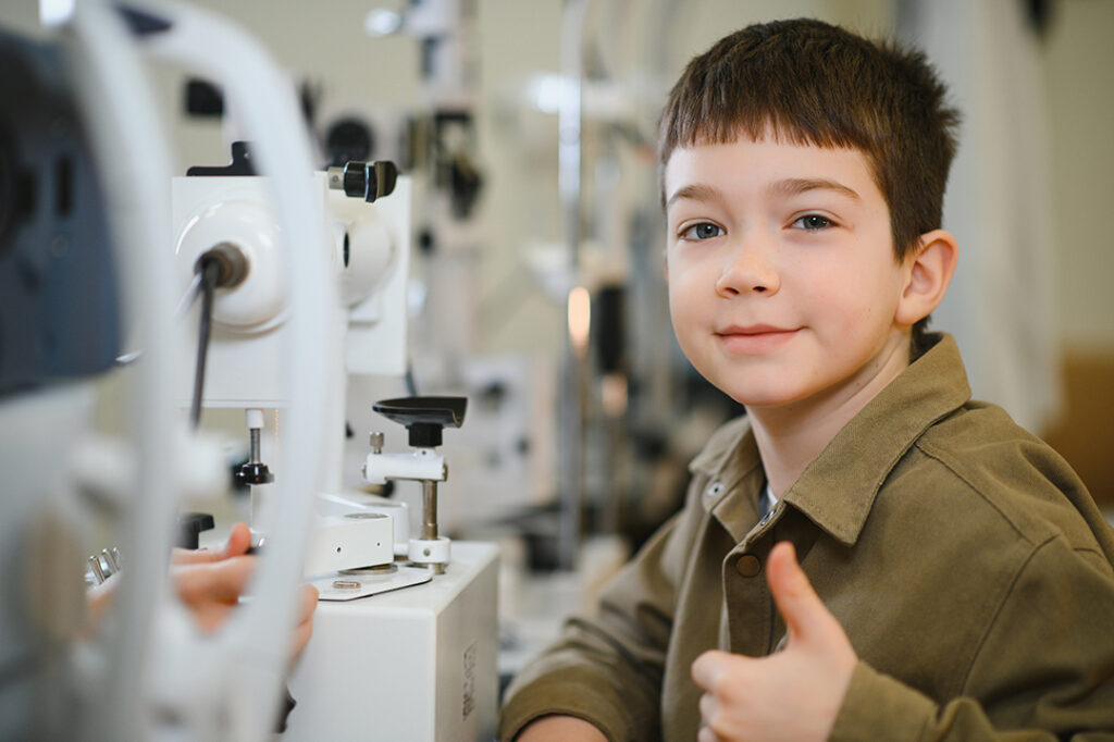 Anxious child fully prepared for his first eye exam